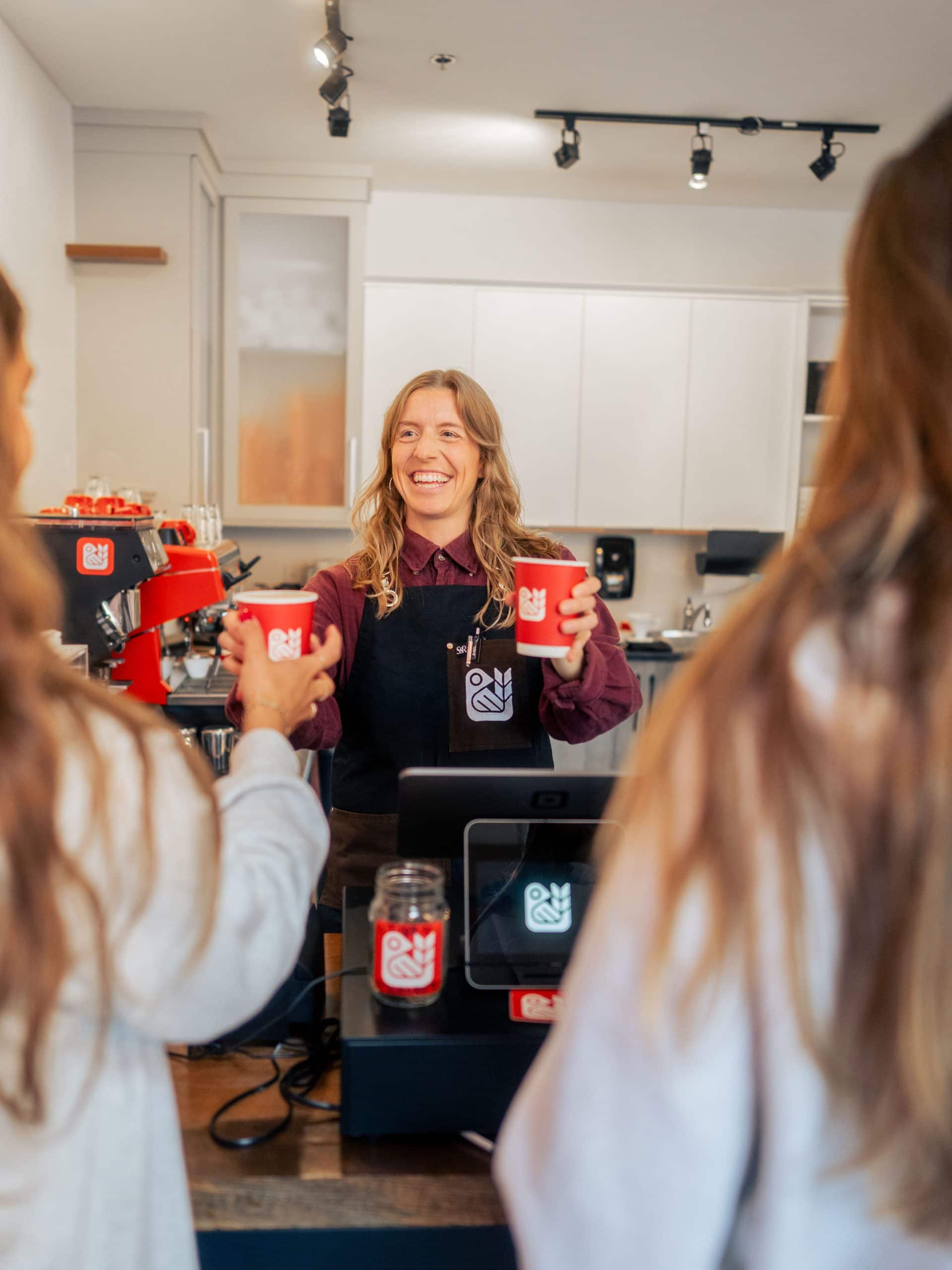 Red Bird Roasting - Handing Over a Coffee to the customer