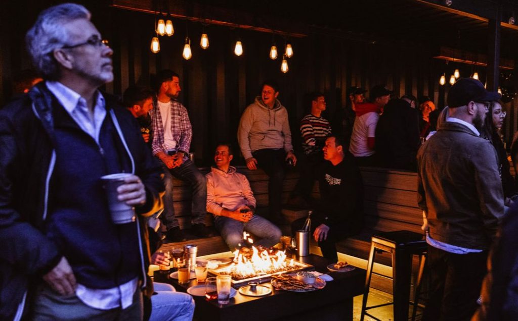People hanging around at the Fire Pits at Red Bird Brewing Kelowna