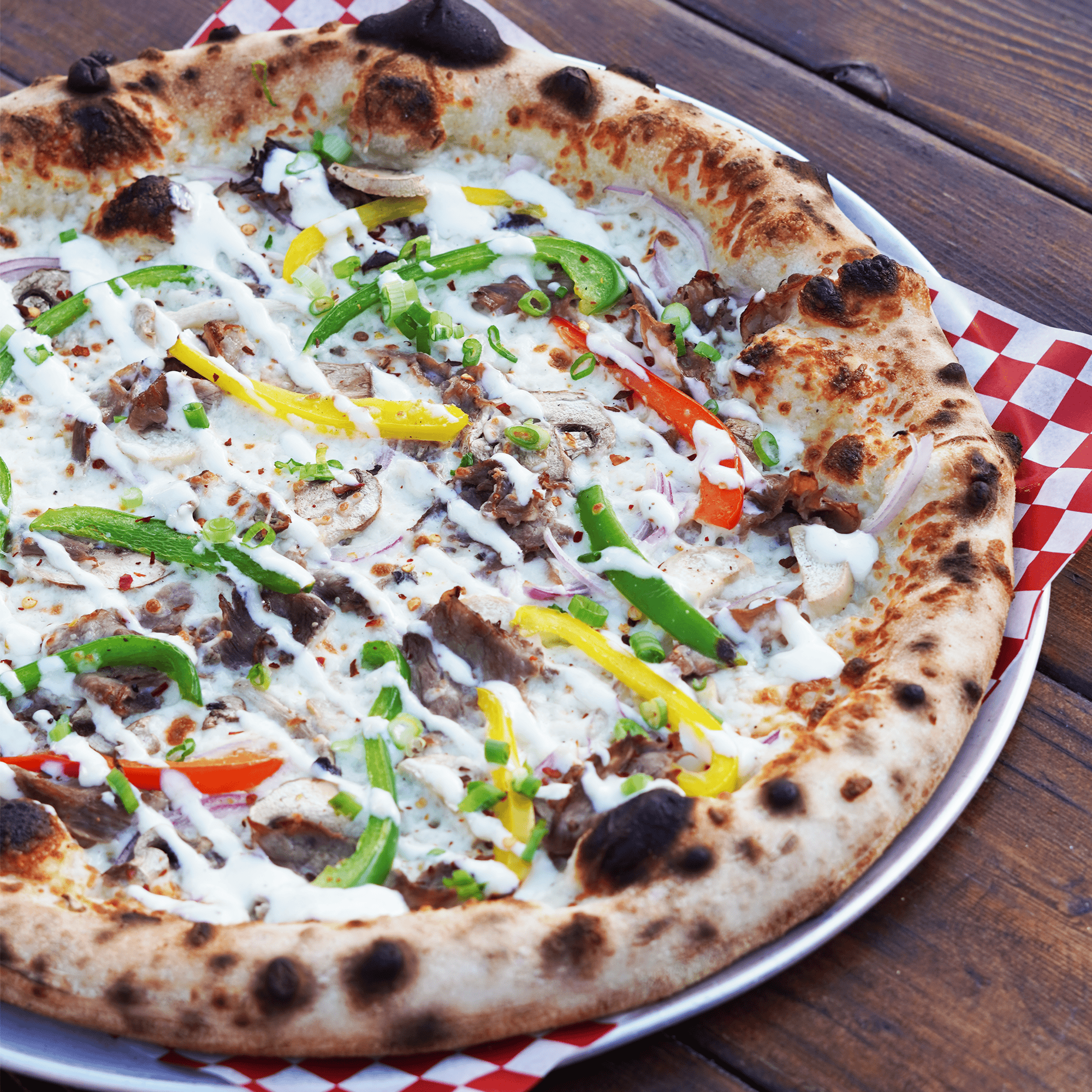 philly cheesesteak pizza at red bird brewing kelowna1