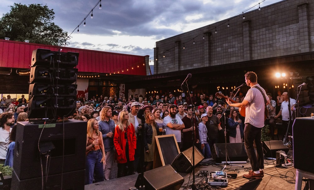 people enjoying live music at red bird brewing kelowna