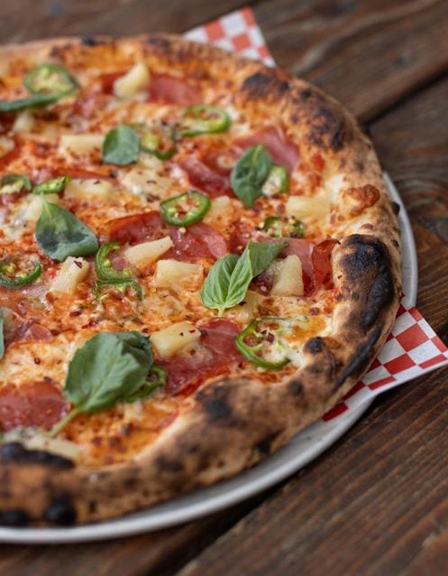 the maui wowie spicy pizza at red bird brewing kelowna